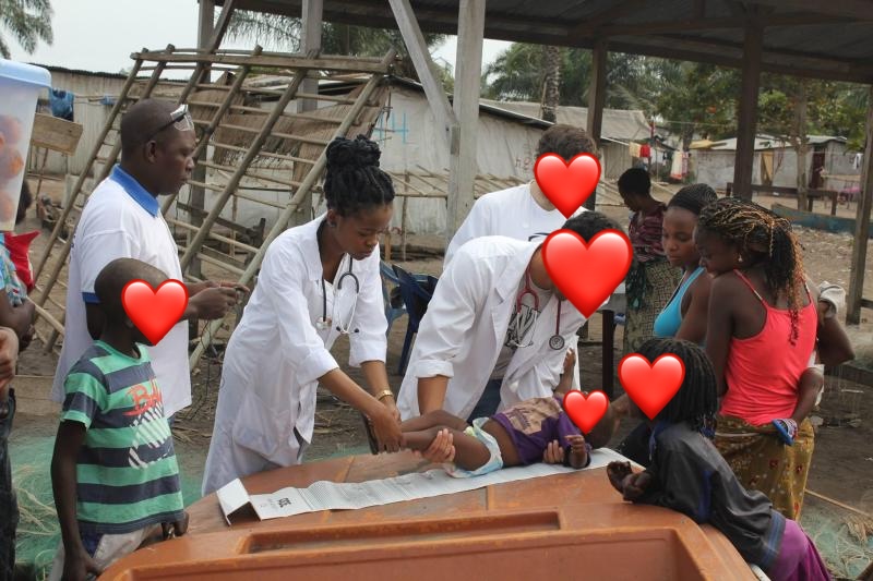 Measuring a child's height during data collection at the Mbubu Island
